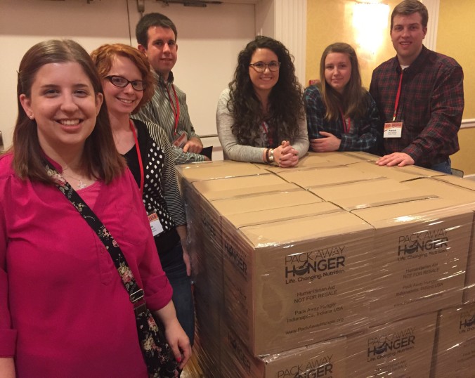 Morgan County Young Farmer members with packed boxes of meals for Pack Away Hunger.